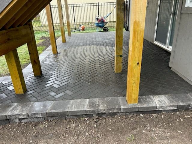 Under-Deck Patio Installation with Herringbone Pattern image